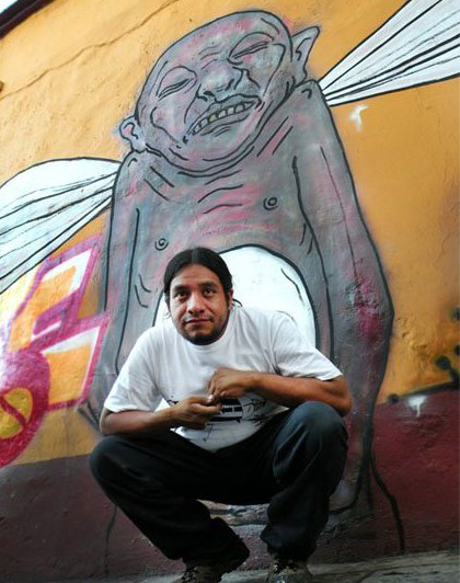 César Chávez in front of his grafitti mural Oaxaca, 2011/