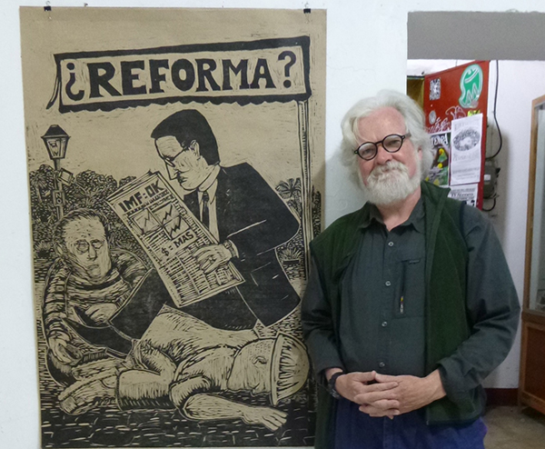 Kevin McCloskey with one of his woodblock prints at Espacio Zapata, Oaxaca.