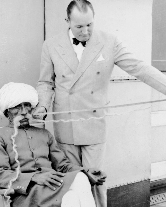 Ripley measuring a moustache.